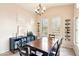 Bright dining area featuring modern wine racks, a bar cabinet, and elegant décor, perfect for entertaining at 6937 E Sierra Morena Cir, Mesa, AZ 85207