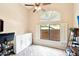 Bright home office with wood look floors, shutters, and a built-in cabinet for clean and organized storage at 6937 E Sierra Morena Cir, Mesa, AZ 85207