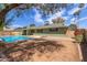 Inviting backyard with a sparkling blue pool, greenery, and patio perfect for outdoor entertaining at 7126 N 29Th Dr, Phoenix, AZ 85051