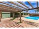 This backyard features a pool, a patio, and mature trees for shade at 7126 N 29Th Dr, Phoenix, AZ 85051