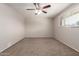 Neutral bedroom with ceiling fan, carpet and window with blinds at 7126 N 29Th Dr, Phoenix, AZ 85051