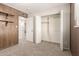 This bedroom features wood paneling, carpet, and a closet for storage at 7126 N 29Th Dr, Phoenix, AZ 85051
