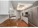 Bright kitchen with granite counters, stainless steel fridge, recessed lighting, and white cabinets at 7126 N 29Th Dr, Phoenix, AZ 85051