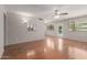 Bright and airy living room with hardwood floors and direct access to the outdoor pool area at 7126 N 29Th Dr, Phoenix, AZ 85051