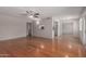 Open living space with gleaming hardwood floors, seamlessly flowing into the kitchen area at 7126 N 29Th Dr, Phoenix, AZ 85051