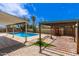 This backyard features a pool, a patio, and a pergola for shade at 7126 N 29Th Dr, Phoenix, AZ 85051