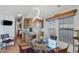 Inviting dining area with a glass table and window views, seamlessly connected to the kitchen at 7750 E Broadway Rd # 538, Mesa, AZ 85208