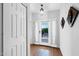 Bright and airy entryway with wood floors, white trim, and a view of the outdoor space at 7750 E Broadway Rd # 538, Mesa, AZ 85208