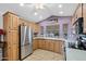 A kitchen with wood cabinets and stainless steel appliances at 7750 E Broadway Rd # 538, Mesa, AZ 85208
