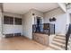 View of the covered front porch and seating area featuring an epoxy floor, storage, and steps to the entry door at 7750 E Broadway Rd # 538, Mesa, AZ 85208