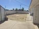 Spacious backyard featuring a storage shed, hardscape, and potential for landscaping at 7821 W Clarendon Ave, Phoenix, AZ 85033