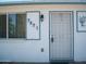 Charming home entrance with secure screen door and prominent house numbers at 7821 W Clarendon Ave, Phoenix, AZ 85033