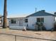 Charming single-story home with desert landscaping and white brick exterior at 7821 W Clarendon Ave, Phoenix, AZ 85033