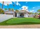 Backyard putting green with flags, adjacent to a white stucco home with a red tile roof and a swimming pool at 7823 N Via Del Mundo --, Scottsdale, AZ 85258