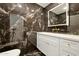 Luxurious bathroom showcasing a marble-tiled shower, modern vanity, and gold hardware at 7823 N Via Del Mundo --, Scottsdale, AZ 85258