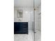 Stylish bathroom featuring a blue vanity, modern fixtures, and a glass shower with detailed tile at 7823 N Via Del Mundo --, Scottsdale, AZ 85258