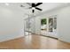 Bright bedroom with light wood floors, mirrored closet doors, and sliding glass doors to the outside at 7823 N Via Del Mundo --, Scottsdale, AZ 85258