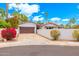 Charming single-story home featuring a 2-car garage, desert landscaping, and red tile roof at 7823 N Via Del Mundo --, Scottsdale, AZ 85258