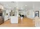 Bright, open kitchen with stainless appliances, a large island, and hardwood floors at 7823 N Via Del Mundo --, Scottsdale, AZ 85258