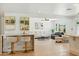 Open-concept living space features bar, hardwood floors, and lots of light at 7823 N Via Del Mundo --, Scottsdale, AZ 85258