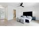 Bright primary bedroom with a ceiling fan, ensuite bathroom, and large closet at 7823 N Via Del Mundo --, Scottsdale, AZ 85258