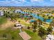 Beautiful aerial shot of a park with a lake, playground, volleyball court, and walking paths at 7911 E San Miguel Ave # 3, Scottsdale, AZ 85250