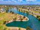 Picturesque aerial view of a serene lake surrounded by lush landscaping and walking trails at 7911 E San Miguel Ave # 3, Scottsdale, AZ 85250