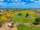 Picturesque aerial view of a park with a playground, sports field, and walking paths at 7911 E San Miguel Ave # 3, Scottsdale, AZ 85250