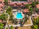 Aerial view of a community pool and spa surrounded by lush landscaping and well-maintained grounds at 7911 E San Miguel Ave # 3, Scottsdale, AZ 85250