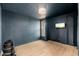 Bedroom with wood floors has a wall-mounted television at 7911 E San Miguel Ave # 3, Scottsdale, AZ 85250