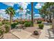 Charming outdoor seating area with lush greenery and mature trees, perfect for relaxation at 7911 E San Miguel Ave # 3, Scottsdale, AZ 85250
