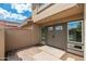 Close-up of front entrance with a brick-paved patio area and stylish front door at 7911 E San Miguel Ave # 3, Scottsdale, AZ 85250