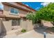 Inviting exterior of townhome features private gate, walkway, and well-manicured landscaping at 7911 E San Miguel Ave # 3, Scottsdale, AZ 85250