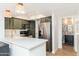 Modern kitchen with stainless steel appliances, quartz countertops, and ample cabinet space at 7911 E San Miguel Ave # 3, Scottsdale, AZ 85250