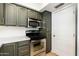 Stylish kitchen boasts stainless steel appliances, new cabinets, and modern fixtures at 7911 E San Miguel Ave # 3, Scottsdale, AZ 85250