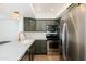 Well-appointed kitchen featuring updated appliances and quartz countertops, perfect for cooking at 7911 E San Miguel Ave # 3, Scottsdale, AZ 85250