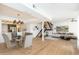 Bright and open-concept living and dining area with stylish furnishings and hardwood floors at 7911 E San Miguel Ave # 3, Scottsdale, AZ 85250