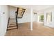 Bright living room with staircase, an open floor plan and hardwood floors at 7911 E San Miguel Ave # 3, Scottsdale, AZ 85250