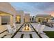 Expansive backyard with a modern fire pit, clean lines, and minimalist landscaping, creating a serene outdoor oasis at 8520 E Cactus Wren Rd, Scottsdale, AZ 85250