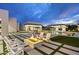 Beautiful backyard with a fire pit and cozy seating, surrounded by lush greenery and pool at 8520 E Cactus Wren Rd, Scottsdale, AZ 85250