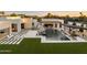 Luxury backyard featuring a pool, spa, outdoor seating, and a covered patio with a grill at 8520 E Cactus Wren Rd, Scottsdale, AZ 85250