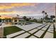Stunning backyard showcasing a pristine pool, stylish umbrellas, and lush landscaping for ultimate relaxation and enjoyment at 8520 E Cactus Wren Rd, Scottsdale, AZ 85250