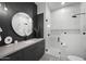 Modern bathroom featuring glass shower, sleek vanity, and stylish fixtures with black accents at 8520 E Cactus Wren Rd, Scottsdale, AZ 85250