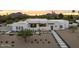 Stylish home with modern design, clean lines, desert landscaping, and a concrete paver walkway at 8520 E Cactus Wren Rd, Scottsdale, AZ 85250