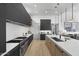 Open concept kitchen with quartz countertops, modern stainless appliances, and wood grain cabinets at 8520 E Cactus Wren Rd, Scottsdale, AZ 85250
