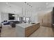 Well-lit open-concept kitchen showcases a large island, sleek fixtures, and a seamless living area at 8520 E Cactus Wren Rd, Scottsdale, AZ 85250