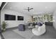 Stylish living room features a bar area, comfortable seating, and large sliding doors at 8520 E Cactus Wren Rd, Scottsdale, AZ 85250