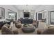 Spacious living room showcases an open floor plan with fireplace, recessed lights, and outdoor access at 8520 E Cactus Wren Rd, Scottsdale, AZ 85250