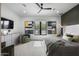 Bright main bedroom with modern decor, neutral tones, and a view of the outdoors at 8520 E Cactus Wren Rd, Scottsdale, AZ 85250