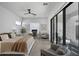 Bright main bedroom features a sitting area, sliding glass doors, and neutral decor at 8520 E Cactus Wren Rd, Scottsdale, AZ 85250